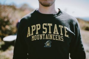 Male torso wearing an Appalachian State University sweatshirt