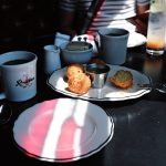 Rosebud Diner in Davis Square in Somerville with light highlighting hush puppy balls.