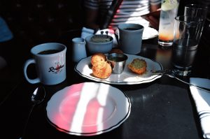 Rosebud Diner in Davis Square in Somerville with light highlighting hush puppy balls.
