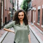 Brianna holds hand to hip for sassy but professional portrait.