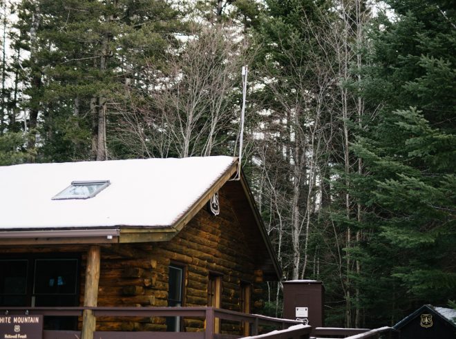Snow covered cabin shows beautiful browns and yellows