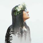 Double exposure features woman looking up and to the right, with Pacific Northwest trees seen through her blouse.