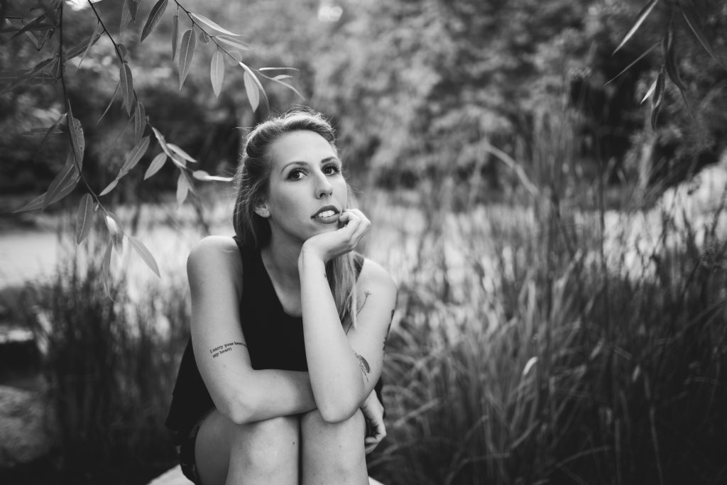 Rebecca Engelhardt sits for an innocent black and white portrait in Elysian Park, Los Angeles.